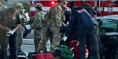 U.S. Army Soldiers with the Florida National Guardsmen with Joint Task Force District of Columbia, in support of the DC Safe and Beautiful mission, assist the interagency partners in providing to injured car passengers at the intersection of 15th Street and Constitution Avenue in Washington, May 5, 2026. (U.S. Air National Guard photo by Staff Sgt. Noah Carlson)