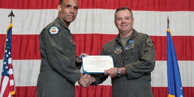 U.S. Air Force Gen. Adrian Spain, commander of Air Combat Command, presents Lt. Col. Christopher M. Beckett, an F-16 Fighting Falcon pilot and 55th Fighter Squadron commander, with the Distinguished Flying Cross during a ceremony at Shaw Air Force Base, South Carolina, May 5, 2026. Beckett received the decoration for the heroism and bravery he exemplified while flying during Operation Midnight Hammer. (U.S. Air Force photo by Senior Airman Nyanda Walker-Potts)