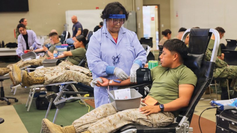A Marine donates blood during a record-breaking Armed Services Blood Program blood drive at Marine Corps Air Ground Combat Center Twentynine Palms, May 6, 2026. The blood drive collected 117 units of blood in support of military operations overseas, setting a new installation record for collections during a single event. (U.S. Navy photo by Christopher Jones