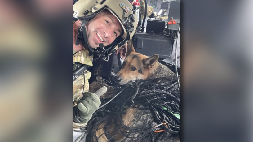 Sgt. 1st Class John Sharbel, a flight paramedic with the Tennessee Army National Guard’s 1-230th Assault Helicopter Battalion, takes a photograph with Jack, a German Shepherd, just after being hoisted into a Black Hawk helicopter during a rescue. Jack and his owner were trapped in a ravine overnight in the Cherokee National Forest, May 2, 2026. Courtesy photo.