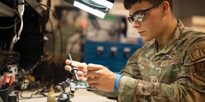 Air Force Senior Airman Kendall Cubero, an electrician assigned to the 439th Airlift Wing’s electrical and environmental shop, solders a circuit board at Westover Air Reserve Base, Mass., May 7, 2026.