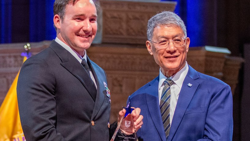 Chief Hospital Corpsman Robert Murphy receives the Hero of Military Medicine Award from Joseph Caravalho, president and chief executive officer of the Henry M. Jackson Foundation for the Advancement of Military Medicine, May 7 in Washington, D.C. The annual Heroes of Military Medicine awards recognize outstanding contributions by senior leaders, medical professionals, and civilians working in the Department of War.