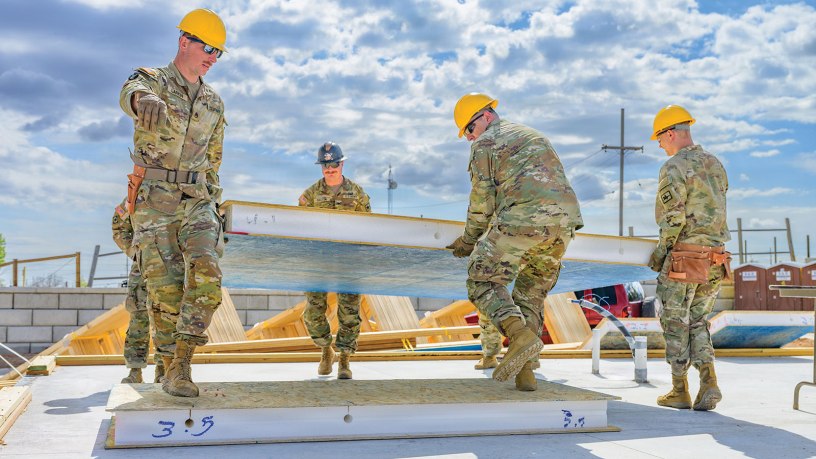 Soldiers assigned to the Wyoming Army National Guard’s 307th Engineer Utilities Detachment carry a wall during a two-week Innovative Readiness Training project providing military engineer training while helping construct homes for local residents in Cheyenne, Wyoming, May 9, 2026. Partnered with Habitat for Humanity, the project is part of the Department of Defense Innovative Readiness Training program, which allows military units to support community organizations while conducting mission-essential engineer training. (U.S. Army National Guard photo by Sgt. 1st Class Cesar Rivas)