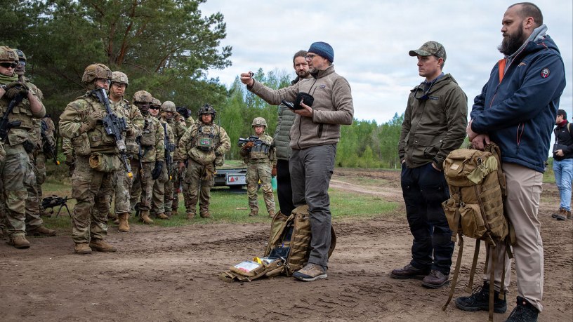 U.S. Soldiers assigned to the 68th Theater Medical Command and the 2d Cavalry Regiment receive instructions on how to properly utilize a medical vital sign monitoring device during an Autonomous Triage and Treatment Challenge taking place near Bemowo Piskie Training Area, Poland, May 10, 2026.