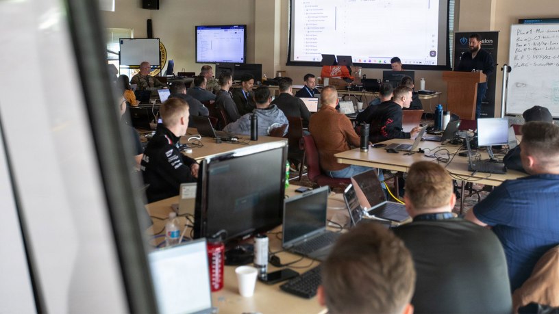 Participants of Cyber Yankee 2026 participate in a training exercise prior to the start of the practical exercise portion of the event at Camp Nett, Niantic, Conn. May 11, 2026. Cyber Yankee is the National Guard’s premier annual regional cyber training exercise, linking military cyber warriors with cyber experts from local utility companies to collaborate and train together on how to respond to credible cyber threats against these pieces of critical infrastructure.