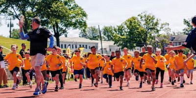 Students from Marine Corps Base Quantico’s Department of War Education Activity schools conduct the mile run event as part of the Presidential Fitness Test at Butler Stadium on MCB Quantico, Virginia, May 12, 2026.