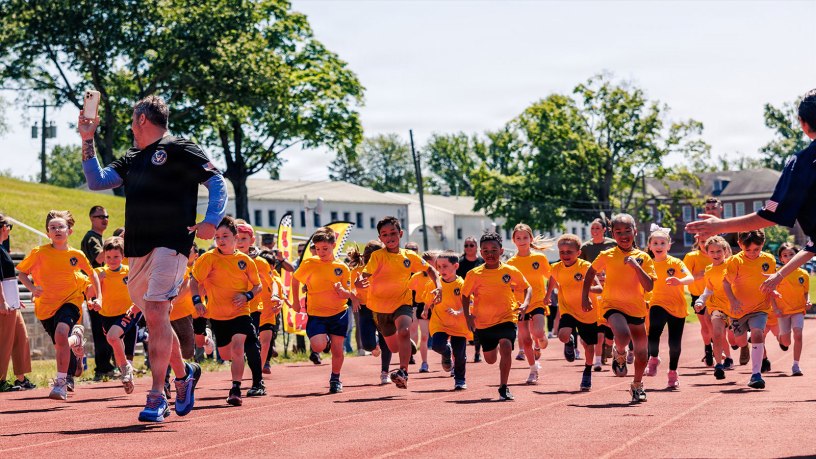 Students from Marine Corps Base Quantico’s Department of War Education Activity schools conduct the mile run event as part of the Presidential Fitness Test at Butler Stadium on MCB Quantico, Virginia, May 12, 2026.