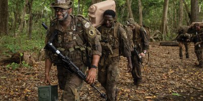 U.S. service members and Panamanian partners move through the jungle while carrying equipment and supplies during the Green Mile event as part of the Jungle Operations Training Course–Panama at Aeronaval Base Cristóbal Colón, Panama, May 14, 2026. The training strengthened interoperability and reinforced the enduring partnership between U.S. forces and Panamanian security institutions through combined jungle operations in a demanding tropical environment. (U.S. Army photo by Sgt. Nirak Garcia Navarro)