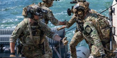 Green Berets with U.S. Army 20th Special Forces Group (Airborne) and Greek special operations forces soldiers load into a rigid hull inflatable boat during Trojan Footprint 2026 at Skaramangas Naval Base, Greece, May 14, 2026.