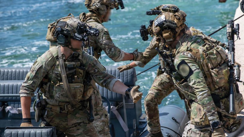 Green Berets with U.S. Army 20th Special Forces Group (Airborne) and Greek special operations forces soldiers load into a rigid hull inflatable boat during Trojan Footprint 2026 at Skaramangas Naval Base, Greece, May 14, 2026.