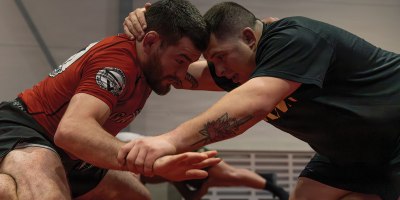 Professional mixed martial arts fighter Jose “Shorty” Torres, left, grapples with Sgt. Aaron Kaczur, assigned to the 196th Mobile Public Affairs Detachment, right, during a mixed martial arts clinic at Tapa Army Base, Estonia, May 15, 2026.
