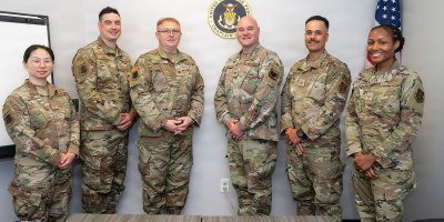 The 177th Fighter Wing Chaplain Corps pose for a group photo with U.S. Air Force Col. Jonathan Bell, center, Air National Guard Chaplain Corps director, at the 177th Fighter Wing, Egg Harbor Township, New Jersey, May 16, 2026. Bell visited the 177th Fighter Wing to award U.S. Air Force Master Sgt. Jason Harden with the Air National Guard Chaplain Corps Minutemen Award for 2025. (U.S. Air National Guard photo by Staff Sgt. Kevin Ray J. Salvador)