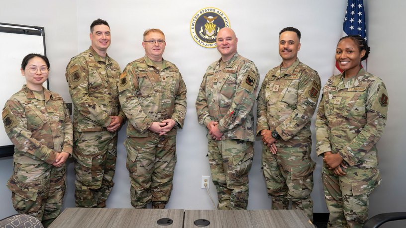 The 177th Fighter Wing Chaplain Corps pose for a group photo with U.S. Air Force Col. Jonathan Bell, center, Air National Guard Chaplain Corps director, at the 177th Fighter Wing, Egg Harbor Township, New Jersey, May 16, 2026. Bell visited the 177th Fighter Wing to award U.S. Air Force Master Sgt. Jason Harden with the Air National Guard Chaplain Corps Minutemen Award for 2025. (U.S. Air National Guard photo by Staff Sgt. Kevin Ray J. Salvador)
