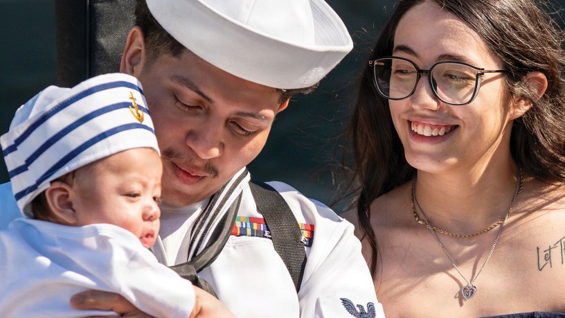 Aircrew Survival Equipmentman 3rd Class Omar Mora, assigned to the world's largest aircraft carrier, USS Gerald R. Ford (CVN 78), meets his newborn child for the first time on the pier at Naval Station Norfolk, May 16, 2026, following a historic 11-month deployment to U.S. 2nd, 4th, 5th, and 6th Fleets as part of the Gerald R. Ford Carrier Strike Group.