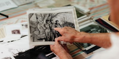 Stanley Martinez, a 96-year-old Army Korean War veteran, holds a photo of his 7th Infantry Division tank crew during an interview at his home in El Centro, Calif., May 19, 2026.