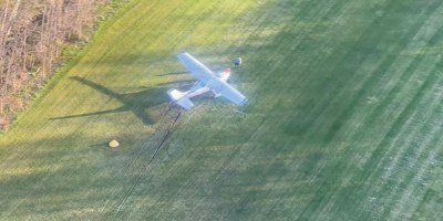 A crashed aircraft lays on the air strip of North Fox Island in Lake Michigan May 20, 2026. A Coast Guard Air Station Traverse City MH-60 Jayhawk aircrew transported two people in stable condition after launching and arriving on scene. (U.S. Coast Guard photo by Air Station Traverse City personnel)