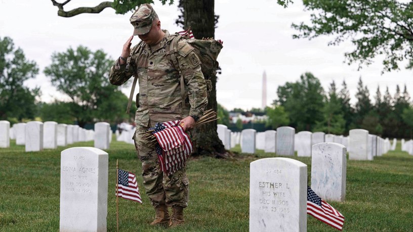 Soldiers assigned to the 3rd U.S. Infantry Regiment place American flags at every gravesite at Arlington National Cemetery, Va., May 21, 2026.