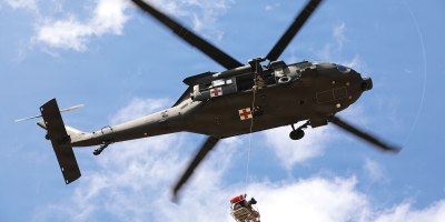 Soldiers assigned to the 36th Combat Aviation Brigade, Texas Army National Guard, conduct a basket lift with a role player and canine during the 2026 Search and Rescue Exercise in the San Antonio area, May 21, 2026.