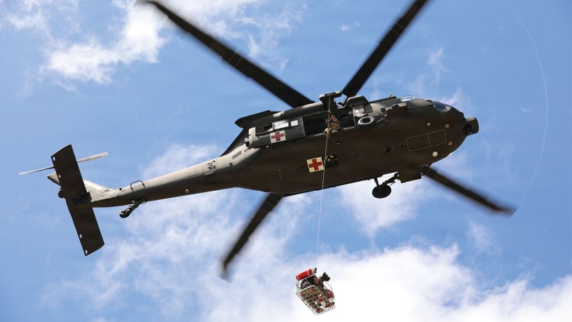 Soldiers assigned to the 36th Combat Aviation Brigade, Texas Army National Guard, conduct a basket lift with a role player and canine during the 2026 Search and Rescue Exercise in the San Antonio area, May 21, 2026.