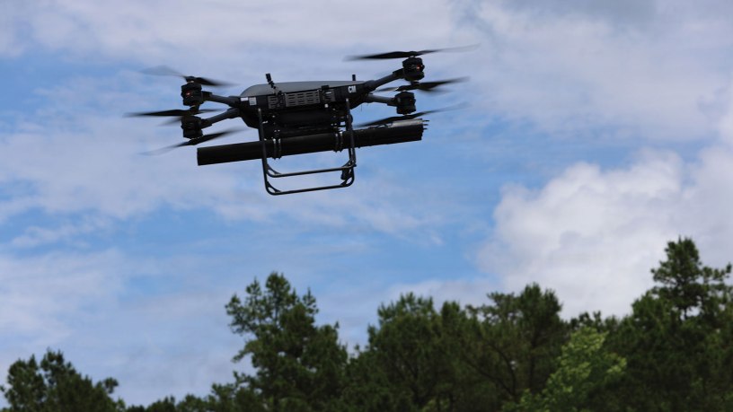 A TRV-150 resupply drone undergoes flight testing at Fort Rucker, Ala., to evaluate flight control software and physical response while carrying a 70 mm rocket launcher. The industry-led initiative aims to provide expeditionary units with organic, precision-strike options using existing inventory like the Hydra family of rockets.