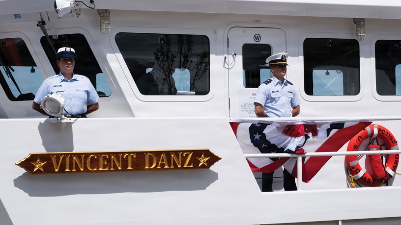 U.S. Coast Guard crew members stand at parade rest while lining the rails aboard USCGC Vincent Danz (WPC 1162) during the cutter’s commissioning ceremony at Pier 86 near the Intrepid Museum in New York, May 22, 2026. The ceremony formally placed the cutter into active Coast Guard service. (U.S. Coast Guard photo by Seaman Braelynn Greene)