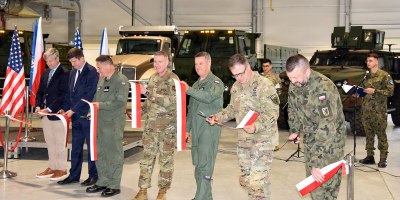 Polish and U.S. military officials cut the ceremonial ribbon together celebrating the completion of the Deployable Air Base System Facilities, Equipment and Vehicle storage site in Powidz, Poland May 27, 2026. The DABS-FEV will store the essentials to make it faster for the U.S. Air Force and NATO Allies to quickly set up and operate from air bases in and around Poland. (U.S. Army photo by Chris Gardner)
