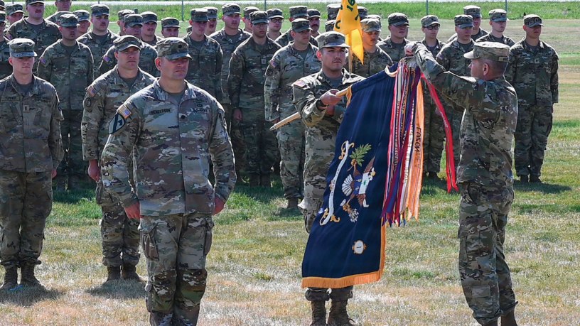 The Superior Unit Award streamer is attached to the organizational colors of the newly redesignated 1st Battalion, 163rd Infantry Regiment during a transformation ceremony at Fort Harrison, Montana, May 27, 2026. The award recognized the battalion’s exceptionally meritorious service during its 2021–2022 deployment to the U.S. Central Command area of operations. (Air National Guard photo by Senior Master Sgt. Devin Doskey)