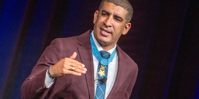 Florent "Flo" Groberg, a retired U.S. Army captain and Medal of Honor recipient, delivers the keynote address at the 2026 Military Health System Conference in Dallas, Texas, May 27. He emphasized that strong teams are built by leaders who listen to their people and recognize the value of every team member’s contribution and experience, regardless of rank, age or position.