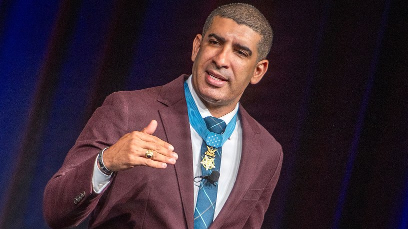 Florent "Flo" Groberg, a retired U.S. Army captain and Medal of Honor recipient, delivers the keynote address at the 2026 Military Health System Conference in Dallas, Texas, May 27. He emphasized that strong teams are built by leaders who listen to their people and recognize the value of every team member’s contribution and experience, regardless of rank, age or position.