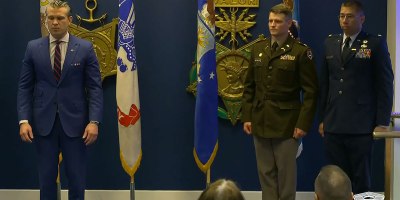 Secretary of War Pete Hegseth presents the Soldier’s Medal to Army Maj. Ryan S. Reynolds, 771st Troop Command Battalion executive officer; and the Airman’s Medal to Air Force Maj. Edwin O. Stanfield, 167th Airlift Wing intelligence officer, during a ceremony at the Pentagon, May 4, 2026.