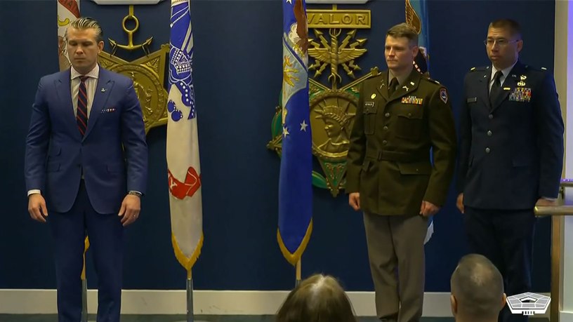 Secretary of War Pete Hegseth presents the Soldier’s Medal to Army Maj. Ryan S. Reynolds, 771st Troop Command Battalion executive officer; and the Airman’s Medal to Air Force Maj. Edwin O. Stanfield, 167th Airlift Wing intelligence officer, during a ceremony at the Pentagon, May 4, 2026.