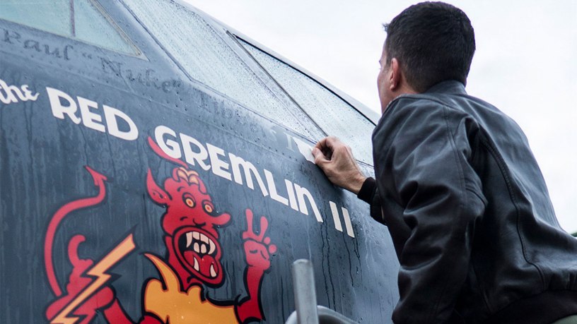 U.S. Air Force Capt. Kerry Baker applies nose art on a 93rd Bomb Squadron B-52H Stratofortress, Nov. 15, 2013, Barksdale Air Force Base, La. The original "Red Gemlin" nose art was on a World War II B-17 bomber piloted by now retired Gen. Paul Tibbets, Jr. U.S. Air Force photo by Master Sgt. Greg Steele.