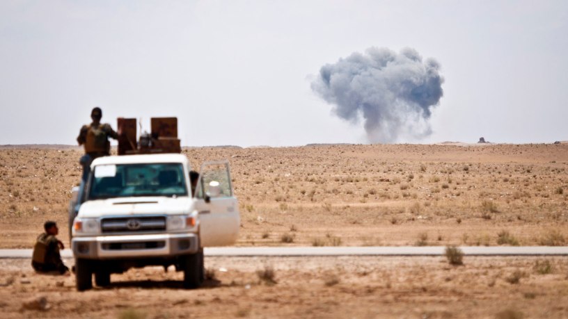 Syrian Democratic Forces watch as a Coalition airstrike hits its target on a known ISIS location near the Iraqi-Syrian border, May 13, 2018.