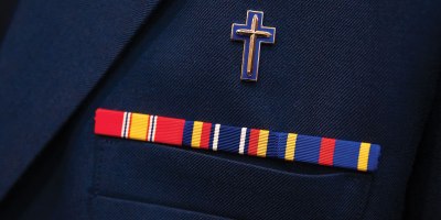 U.S. Air Force Cpt. Steve Thiel, a chaplain assigned to the 103rd Airlift Wing, Connecticut Air National Guard, wears his dress uniform to speak before members of the Connecticut legislature inside the Connecticut State Capitol, Hartford, Connecticut, June 1, 2023. Above Thiel’s ribbons is an Air Force specialty insignia to denote Thiel as a Christian Chaplain. (U.S. Army photo by Sgt. Matthew Lucibello)