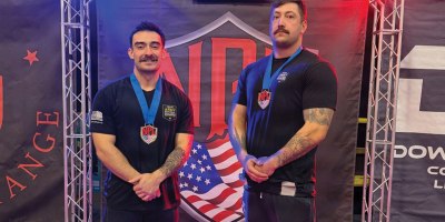 Oregon Army National Guard Sgt. Sean Vary, assigned to the RSP section of the Region B Oregon Army recruiting (left), and Staff Sgt. Kody Stonelake, an Oregon Army National Guard Recruiter (right) in Springfield, pause for a photo after their record-setting performance at the National Power Lifting League Sam Pektol Open on February 28, 2026, in Lebanon, Oregon.
