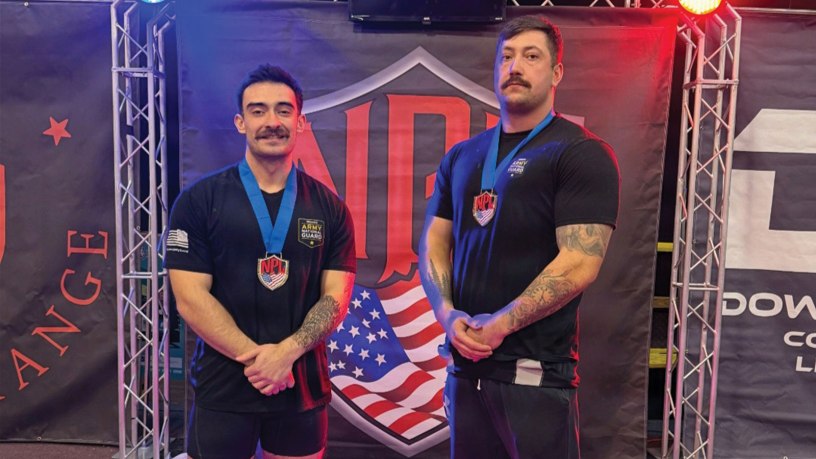 Oregon Army National Guard Sgt. Sean Vary, assigned to the RSP section of the Region B Oregon Army recruiting (left), and Staff Sgt. Kody Stonelake, an Oregon Army National Guard Recruiter (right) in Springfield, pause for a photo after their record-setting performance at the National Power Lifting League Sam Pektol Open on February 28, 2026, in Lebanon, Oregon.