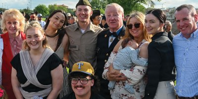 Retired Sgt. 1st Class Sammie L. Davis, a Medal of Honor recipient, is pictured with his grandson, Pfc. Reuben Brinkmeter, and family members at the U.S. Army Medical Center of Excellence 68W graduation, March 15 on MacArthur Parade Field.