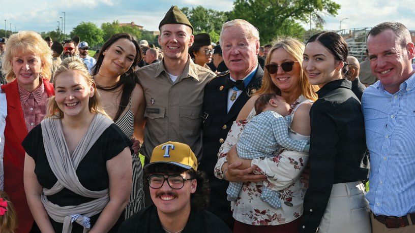 Retired Sgt. 1st Class Sammie L. Davis, a Medal of Honor recipient, is pictured with his grandson, Pfc. Reuben Brinkmeter, and family members at the U.S. Army Medical Center of Excellence 68W graduation, March 15 on MacArthur Parade Field.