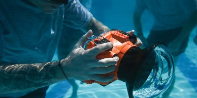 U.S. Air Force Staff Sgt. Mike Janker, assigned to the 4th Combat Camera Squadron, practices using an underwater camera housing in the pool at Joint Base Charleston, South Carolina, May 15, 2026.