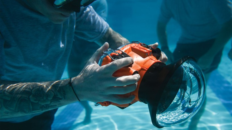 U.S. Air Force Staff Sgt. Mike Janker, assigned to the 4th Combat Camera Squadron, practices using an underwater camera housing in the pool at Joint Base Charleston, South Carolina, May 15, 2026.