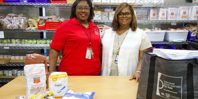 Christina Drones, Director of Agency Relations and Program Services for Mid-South Food Bank (left) and Rosemary Campbell, program coordinator for the food pantry program (right) pose for a photo during the soft opening of the Lt. Col. Luke Weathers, Jr. VA Medical Center food hub in Memphis, Tennessee, May 21, 2026.