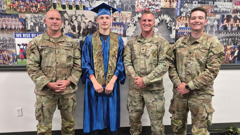 Sgt. 1st Class Ian Walker, Pvt. Logan May, Staff Sgt. Kolten Conant and Spc. Dustyn Sneider pose for a photo on May 22, 2026, at Midvale High School in Midvale, Idaho. Just five days before, May suffered a cardiac arrest during a fitness training event and Walker, Conant and Sneider worked together to revive May, which likely saved his life. Conant recruited May into the Idaho Army National Guard in April.