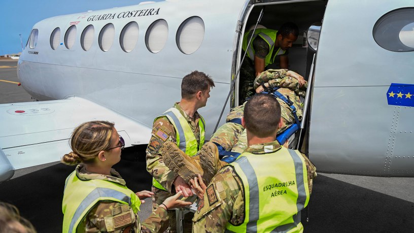 New Hampshire National Guard medical personnel and Cabo Verde Armed Forces Medical Unit members load a simulated patient aboard a C-12 Huron multipurpose aircraft assigned to the Cabo Verde Coast Guard Air Squadron during an aeromedical knowledge exchange in Praia, Cabo Verde, May 22, 2026.