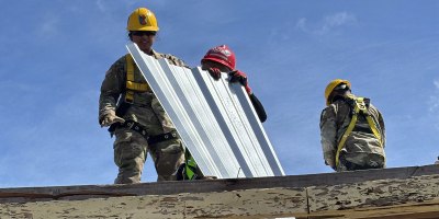 Soldiers assigned to the 797th and 871st Engineer Vertical Construction Companies support temporary roofing operations in Saipan, Commonwealth of the Northern Mariana Islands, following Super Typhoon Sinlaku, which struck the CNMI as a Category 4 storm on April 14.