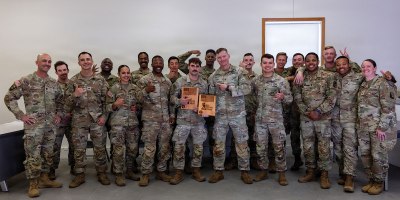 U.S. Army Soldiers pose for a group photo during the 2026 Spc. Hilda I. Clayton Best Combat Camera Competition at Fort McCoy, Wisconsin, May 27, 2026.