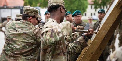 U.S. Army Soldiers of the Alpha Company, 8th Brigade Engineer Battalion, 2nd Armored Brigade Combat Team, 1st Cavalry Division, demonstrate how they would conduct a door breach alongside Polish Military Fire Service, Land Forces Training Center Orzysz, Military Unit No. 2098, Bemowo Piskie Training Area, Poland, May 28, 2026.
