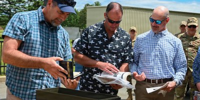 104th Fighter Wing members and alumni join to open a time capsule that had been tucked away in an A-10 static display at Barnes for 29 years, May 28, 2026, at Barnes Air National Guard Base, Westfield, MA.