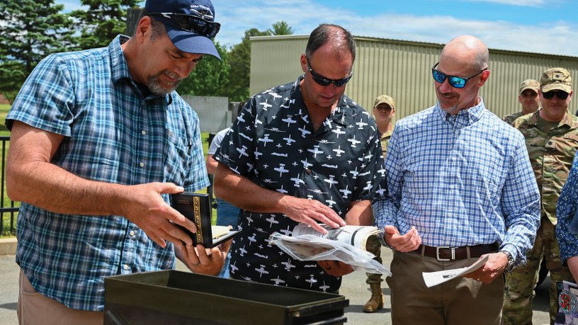 104th Fighter Wing members and alumni join to open a time capsule that had been tucked away in an A-10 static display at Barnes for 29 years, May 28, 2026, at Barnes Air National Guard Base, Westfield, MA.
