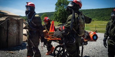 Service members from the New York and New Jersey National Guard Homeland Response Force conduct casualty extraction and hazardous environment response training under the instruction of the West Virginia National Guard during a regional chemical, biological, radiological and nuclear, or CBRN, response exercise. The training focused on lifesaving operations, interagency coordination and rapid response capabilities during large-scale domestic emergencies. Photo by Sgt. Tristan Murry.