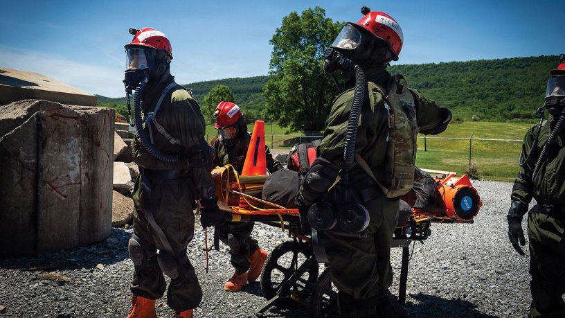 Service members from the New York and New Jersey National Guard Homeland Response Force conduct casualty extraction and hazardous environment response training under the instruction of the West Virginia National Guard during a regional chemical, biological, radiological and nuclear, or CBRN, response exercise. The training focused on lifesaving operations, interagency coordination and rapid response capabilities during large-scale domestic emergencies. Photo by Sgt. Tristan Murry.